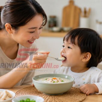 Seorang ibu memberikan semangkuk bubur hangat kepada anak saat sarapan pagi dengan suasana dapur yang cerah. (Foto: dok/previews.sriwijayaterkini.id)
